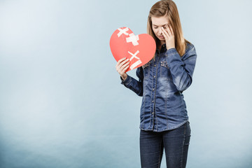 Young woman with broken heart