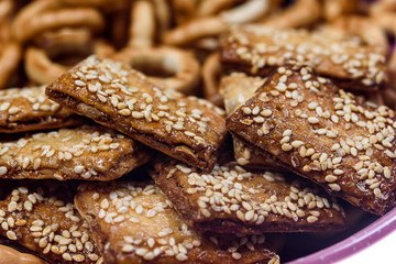 biscuits with sesame seeds and small bagels photographed macro