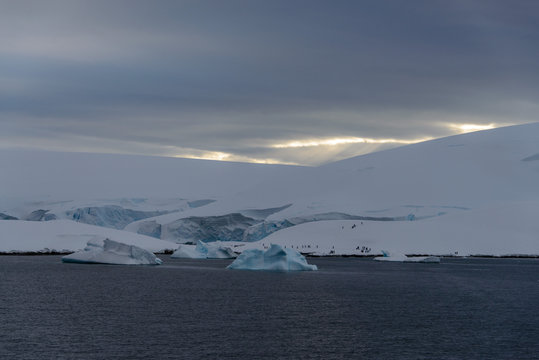 Antarctic landscape with people on snow