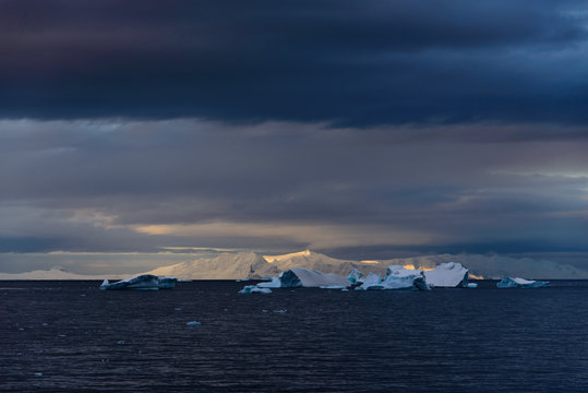 Antarctic landscape with sea and mountains