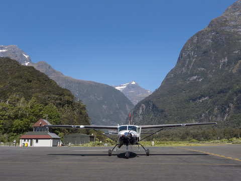 Milford Sound New Zealand. Aircraft at Milford sound airport. Airstrip. Fiordland. Piper cub airplane.