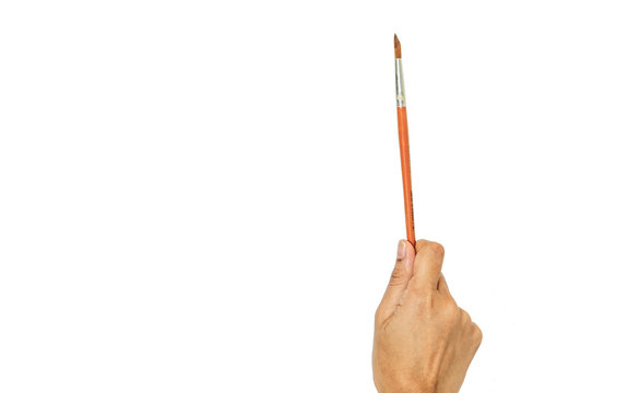 Female Hand Holding Paint Brush, woman drawing a picture with a brush