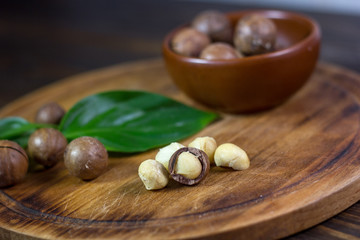 Macadamia nuts on a wooden kitchen board.