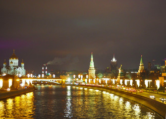 View from the bridge to the Kremlin, temple of Christ the Savior, Moscow river and Moscow City. Panorama at night, Moscow, Russia