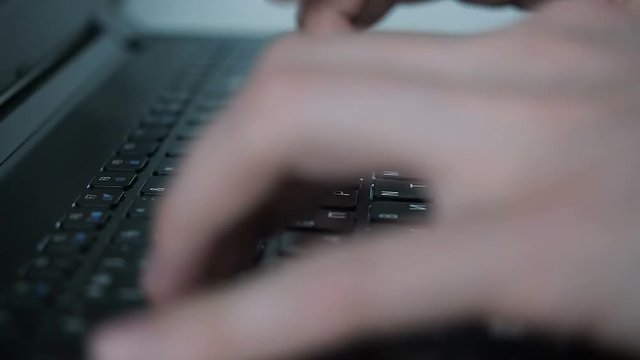 man type text on keyboard