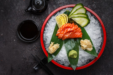 Japanese cuisine. Salmon sushi on ice.