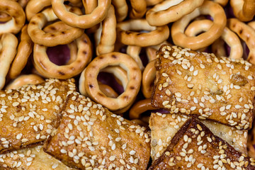biscuits with sesame seeds and small bagels photographed macro