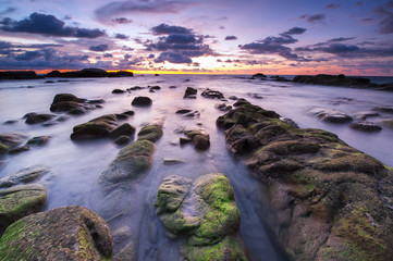 beautiful view of sunset seascape with green moss at Kudat, Sabah Malaysia.