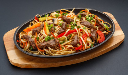 Asian food. Home made noodles with meat and vegetables.
