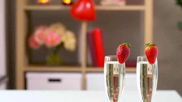 red sweets and champagne in st valentines day