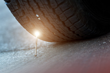 Car tyre stung with nail.