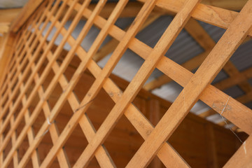 Wooden grating, decorative fencing. Texture. Close up