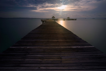 Wooden pier between sunset in Thailand
