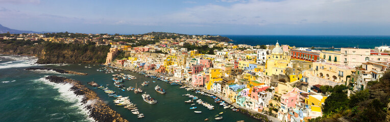 Fototapeta na wymiar Procida Island with colorful houses on Neapolitan Bay in Italy
