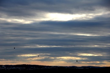 Dramatic sky with balloons.