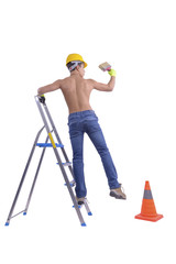 Young male decorator painting with a paint brush.