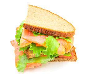 sandwich with smoked salmon,salad and lemon