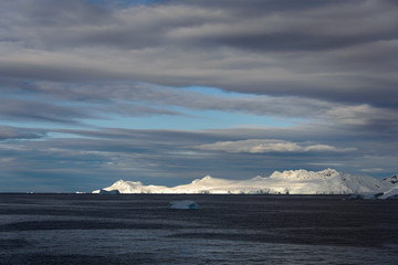 Antarctic landscape with sea and mountains