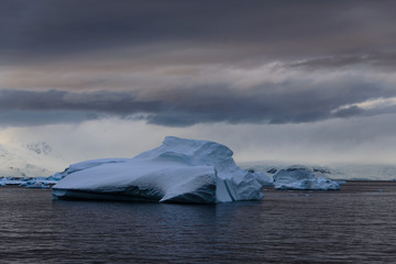 Antarctic landscape with iceberg