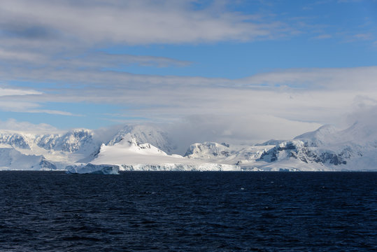 Antarctic landscape with sea and mountains