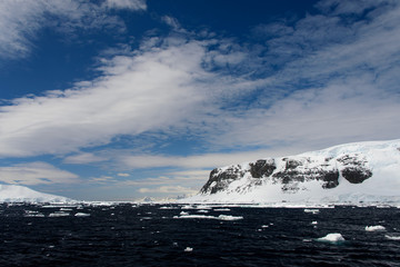 Antarctic landscape with sea and mountains