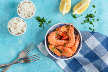 Plate with fried prawns and rice. Seafood.