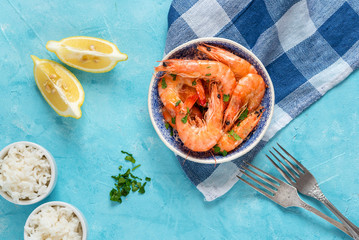 Plate with fried prawns and rice. Seafood.