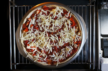 home cooking pizza, peppers tomatoes mozzarella. Close-up Pizza, blur, selective focus