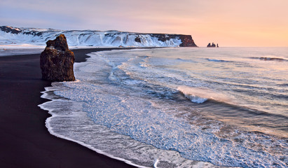 Famous black sand beach at Reynisfjall, South Iceland in winter.