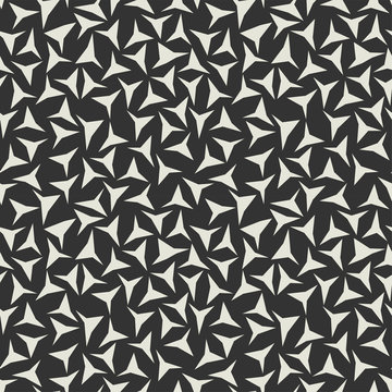 Abstract background, seamless texture. Soft tone beige colous triangles on brown black background.
