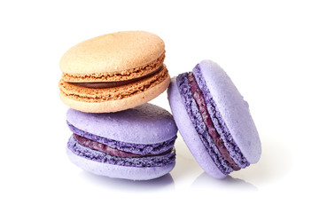 Violet and beige macarons on white