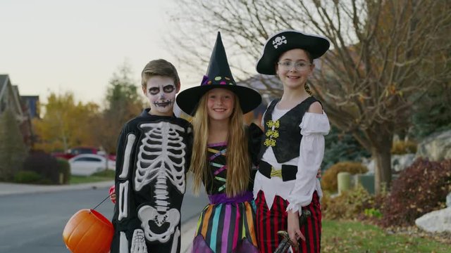 Portrait of neighborhood children wearing Halloween costumes / Cedar Hills, Utah, United States