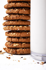 glass of milk and oats cookies