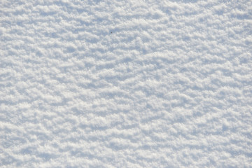 Fototapeta premium snow for texture or background at sunny day, bright light with shadows, flat lay, top view, clean and nobody