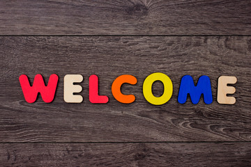 Word Welcome from wooden letters 