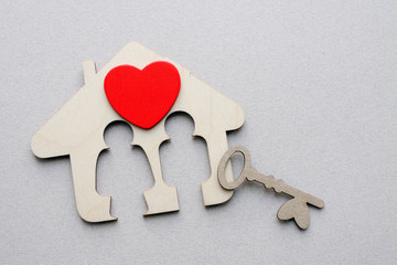 wooden house shape with key