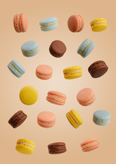 Colorful macarons cakes. Small French cakes. Sweet and colorful french macaroons falling or flying in motion.