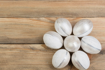 Happy Easter. Painted eggs on wooden table. Top view.