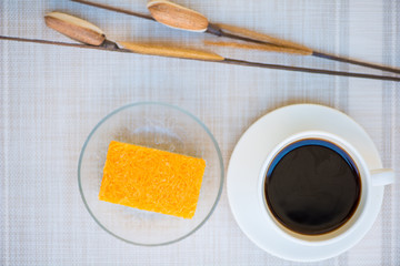 A cup of coffee and golden threads cake