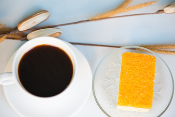 A cup of coffee and golden threads cake