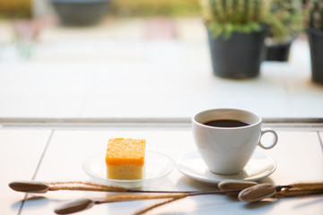 A cup of coffee and golden threads cake