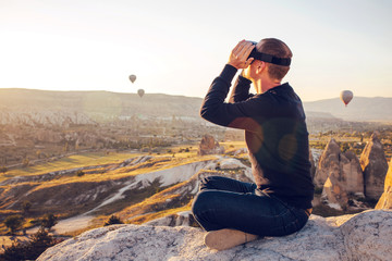 The man with glasses of virtual reality. Future technology concept. Modern imaging technology.