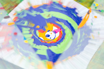 Fototapeta premium background, modern art, handcraft concept. abstract blured picture of colorful circle that is painted on the square piece of white paper with bright gouache