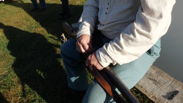 Civil War Musket Rifle Gun Being Cleaned Close Up on Hands