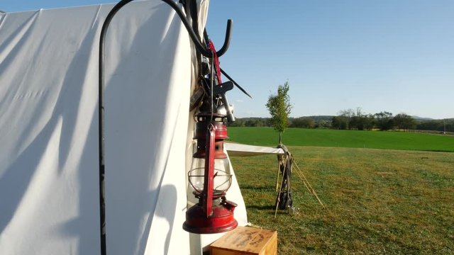 Civil War Tent with Red Lantern and Rolling Green Fields