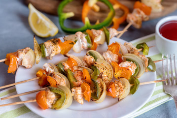 Skewers with chicken, peppers and onions.