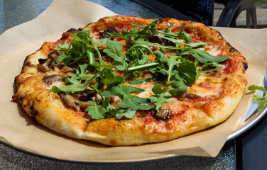 Mushroom and arugula pizza.