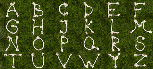 Rope alphabet on grass. Letters from A to Z