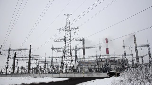 Power lines in the snow. Cogeneration plant in a strong blizzard