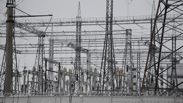 Power lines in the snow. Cogeneration plant in a strong blizzard